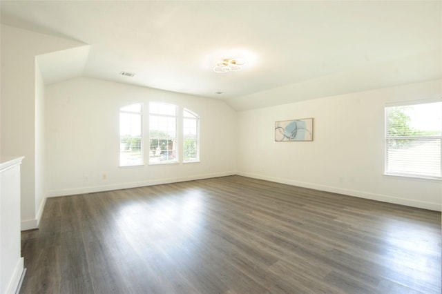 9507 Flying Eagle Ct, Houston, TX 77083 - spare room with vaulted ceiling, healthy amount of natural light, dark wood-style flooring, and baseboards