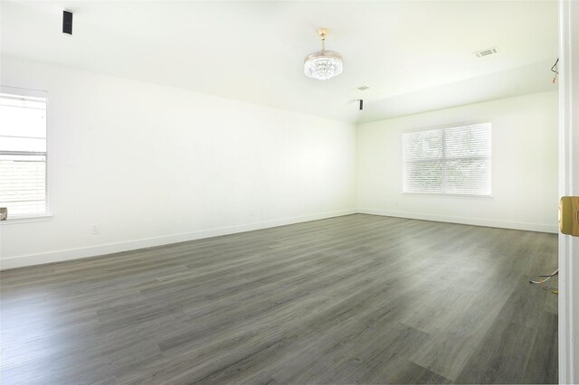 9507 Flying Eagle Ct, Houston, TX 77083 - unfurnished room featuring healthy amount of natural light, baseboards, and wood finished floors