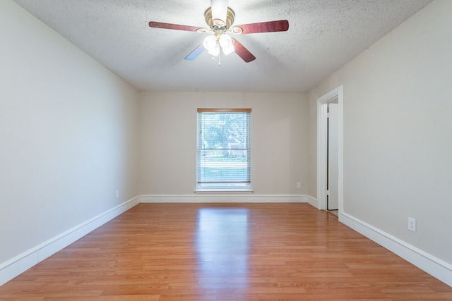16466 Mandate Dr, Houston, TX 77049 - spare room featuring ceiling fan, a textured ceiling, light wood-style floors, and baseboards