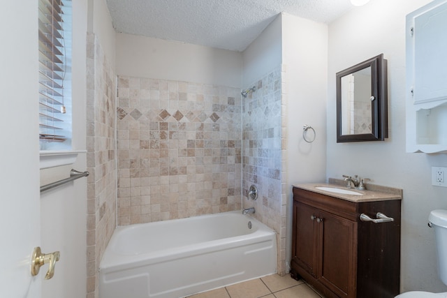 16466 Mandate Dr, Houston, TX 77049 - full bathroom with tile patterned flooring, shower / tub combination, vanity, toilet, and a textured ceiling
