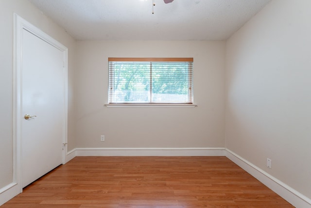 16466 Mandate Dr, Houston, TX 77049 - spare room featuring light wood-style floors, baseboards, and ceiling fan