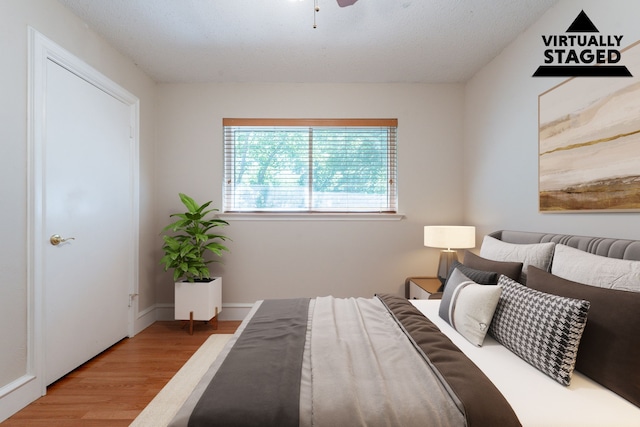 16466 Mandate Dr, Houston, TX 77049 - bedroom with wood finished floors and ceiling fan