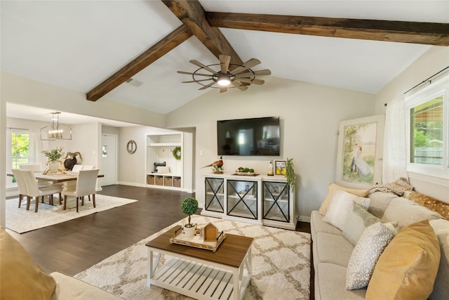 1209 Kansas Ave S, Anahuac, TX 77514 - living area featuring wood finished floors, a chandelier, plenty of natural light, and a ceiling fan
