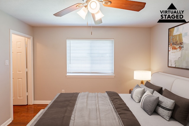18307 Shadow Grove Ln, Crosby, TX 77532 - bedroom with wood finished floors, a ceiling fan, and baseboards