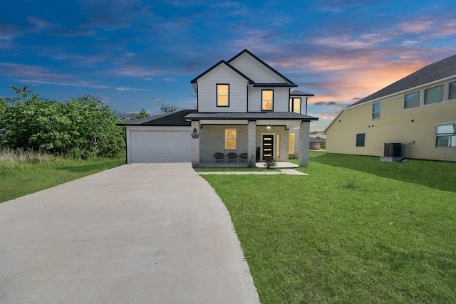 273 Rd 5134, Cleveland, TX 77327 - view of front of property featuring driveway, a front yard, central air condition unit, an attached garage, and covered porch