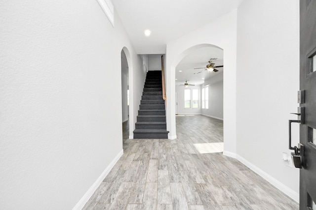 273 Rd 5134, Cleveland, TX 77327 - entrance foyer with ceiling fan, wood finished floors, arched walkways, stairway, and baseboards