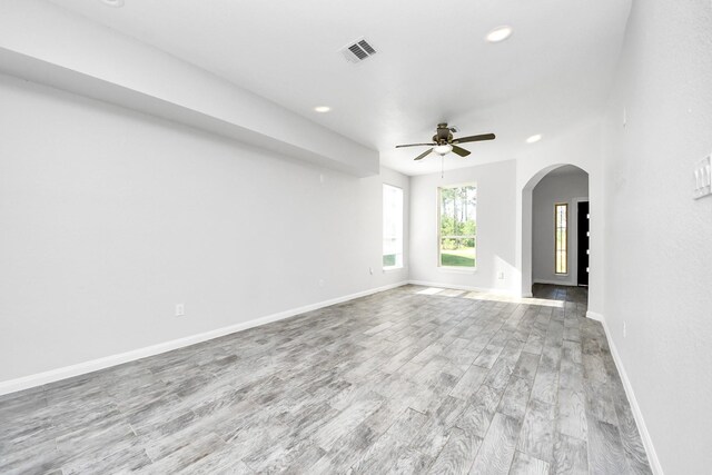 273 Rd 5134, Cleveland, TX 77327 - unfurnished living room featuring recessed lighting, a ceiling fan, arched walkways, wood finished floors, and baseboards