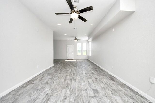 273 Rd 5134, Cleveland, TX 77327 - unfurnished living room with a ceiling fan, baseboards, recessed lighting, and light wood-style flooring