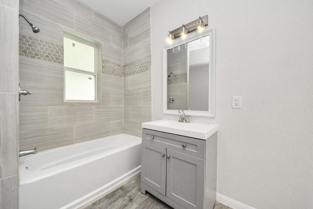 273 Rd 5134, Cleveland, TX 77327 - bathroom featuring vanity, shower / tub combination, wood finished floors, and baseboards