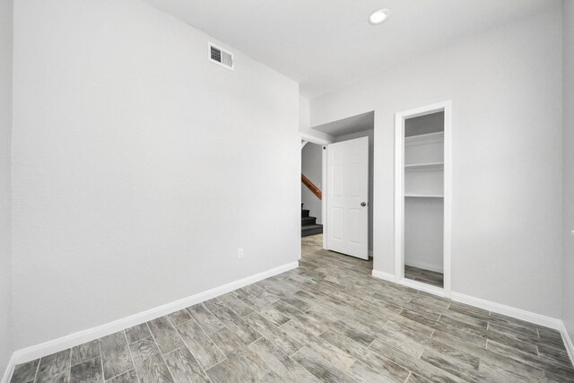 273 Rd 5134, Cleveland, TX 77327 - unfurnished room with stairway, baseboards, and wood finished floors