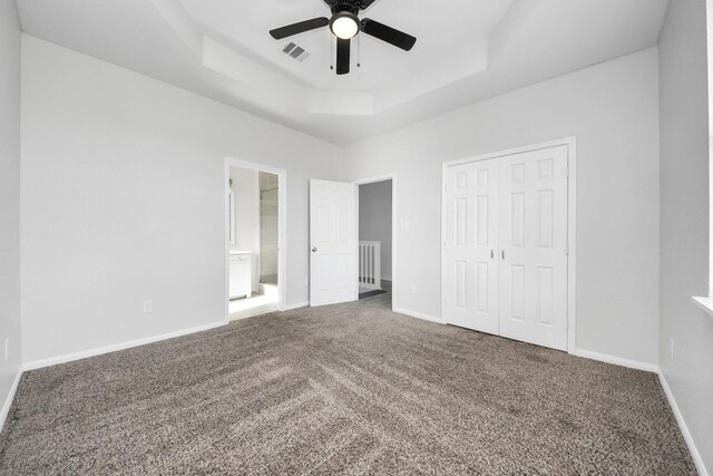 273 Rd 5134, Cleveland, TX 77327 - unfurnished bedroom with a raised ceiling, carpet, a closet, baseboards, and ceiling fan