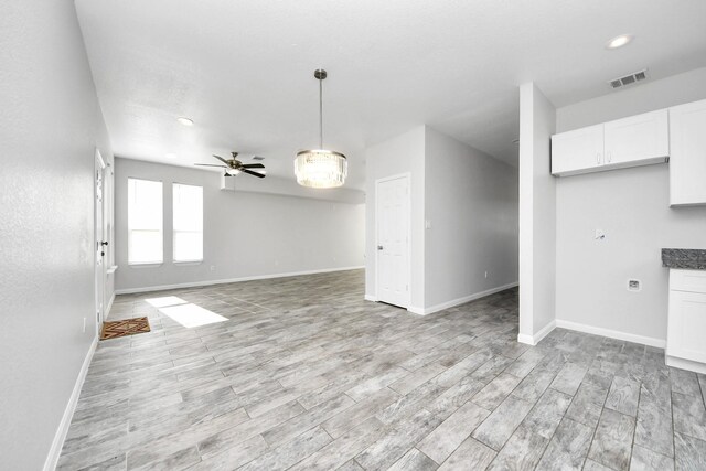 273 Rd 5134, Cleveland, TX 77327 - unfurnished living room with baseboards, light wood-type flooring, ceiling fan, and recessed lighting