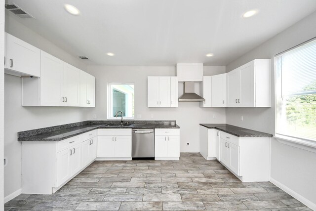 273 Rd 5134, Cleveland, TX 77327 - kitchen with stainless steel dishwasher, a sink, recessed lighting, wall chimney range hood, and white cabinets