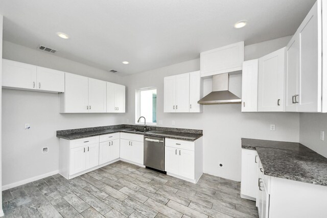 273 Rd 5134, Cleveland, TX 77327 - kitchen featuring wall chimney range hood, dishwasher, white cabinetry, a sink, and recessed lighting