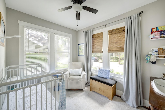 3708 Watson St, Houston, TX 77009 - carpeted bedroom featuring a nursery area, multiple windows, and ceiling fan