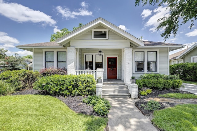 3708 Watson St, Houston, TX 77009 - view of front of house featuring covered porch, a front lawn, and roof with shingles