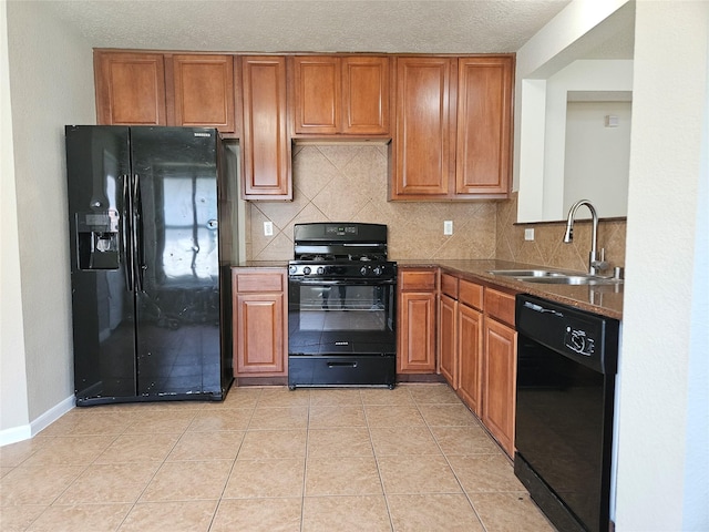 20731 Cypress Post Dr, Cypress, TX 77433 - kitchen featuring black appliances, a sink, and brown cabinets