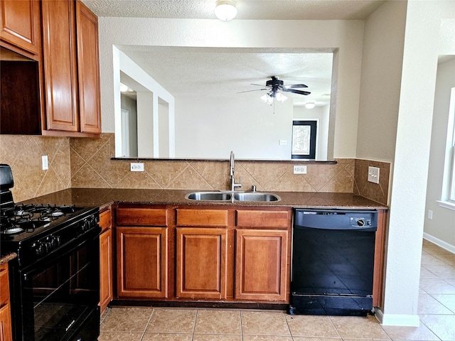20731 Cypress Post Dr, Cypress, TX 77433 - kitchen with black appliances, a sink, a ceiling fan, light tile patterned floors, and brown cabinetry