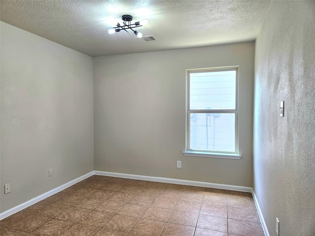 20731 Cypress Post Dr, Cypress, TX 77433 - tiled empty room with healthy amount of natural light, a textured ceiling, and baseboards