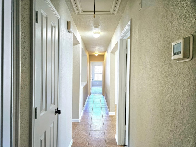 20731 Cypress Post Dr, Cypress, TX 77433 - corridor featuring a textured wall, light tile patterned flooring, and a textured ceiling