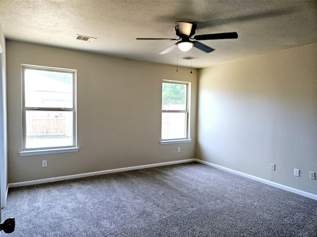 20731 Cypress Post Dr, Cypress, TX 77433 - empty room featuring ceiling fan, a textured ceiling, carpet, baseboards, and a textured wall
