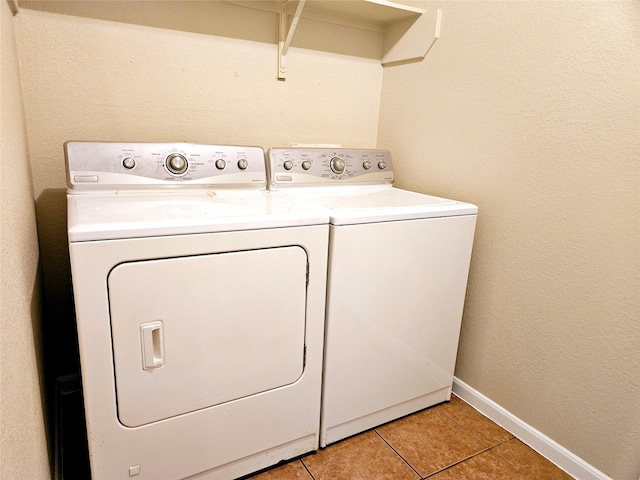 20731 Cypress Post Dr, Cypress, TX 77433 - washroom featuring washer and dryer, light tile patterned floors, and baseboards