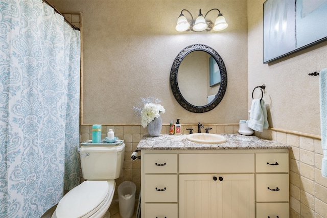 4430 Fm 546, Princeton, TX 75407 - bathroom with tile walls, wainscoting, toilet, vanity, and curtained shower