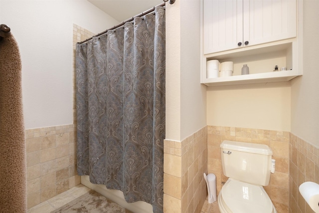 4430 Fm 546, Princeton, TX 75407 - full bathroom featuring tile walls, a wainscoted wall, toilet, and tile patterned floors