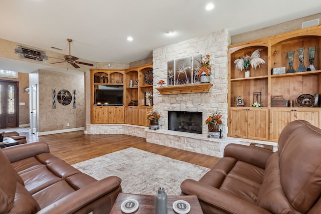 4430 Fm 546, Princeton, TX 75407 - living room with wood finished floors, a ceiling fan, a stone fireplace, recessed lighting, and baseboards