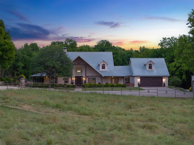 4430 Fm 546, Princeton, TX 75407 - view of front of property with a chimney, metal roof, an attached garage, and driveway