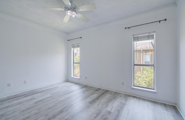 716 Bering Dr Unit 30, Houston, TX 77057 - empty room featuring wood finished floors, healthy amount of natural light, a ceiling fan, and baseboards