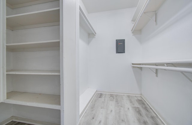 716 Bering Dr Unit 30, Houston, TX 77057 - walk in closet with wood finished floors and electric panel