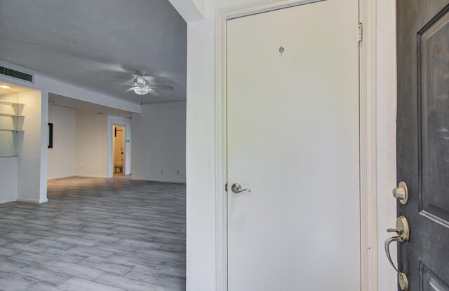 716 Bering Dr Unit 30, Houston, TX 77057 - entryway featuring ceiling fan, baseboards, and wood finished floors