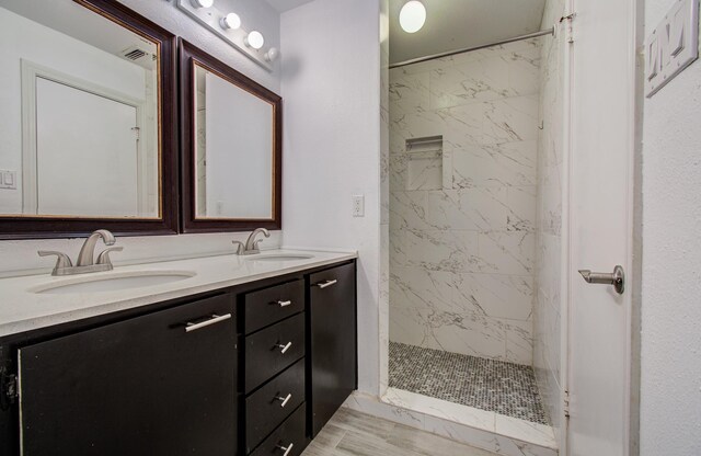 716 Bering Dr Unit 30, Houston, TX 77057 - bathroom with double vanity and tiled shower