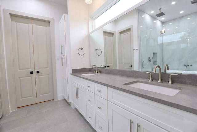 510 E 37th St, Houston, TX 77022 - bathroom featuring a shower stall, tile patterned floors, double vanity, and recessed lighting