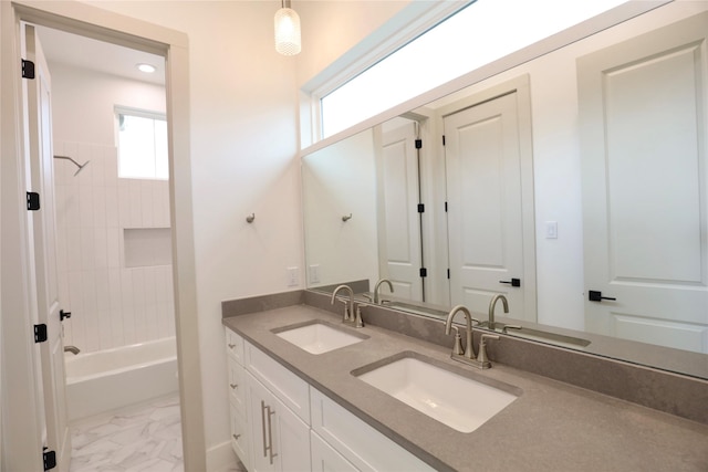 510 E 37th St, Houston, TX 77022 - bathroom featuring marble finish flooring, plenty of natural light, double vanity, shower / tub combination, and recessed lighting