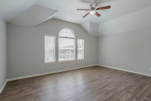 13035 Echo Landing Dr, Houston, TX 77070 - unfurnished room featuring vaulted ceiling, dark wood finished floors, ceiling fan, and baseboards