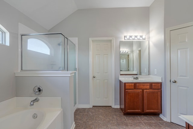 13035 Echo Landing Dr, Houston, TX 77070 - full bathroom featuring a stall shower, a bath, vanity, and vaulted ceiling