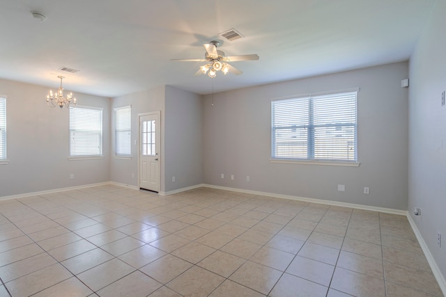 13035 Echo Landing Dr, Houston, TX 77070 - unfurnished room with light tile patterned floors, a chandelier, ceiling fan, baseboards, and a smoke detector