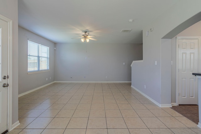 13035 Echo Landing Dr, Houston, TX 77070 - spare room featuring ceiling fan, light tile patterned floors, and baseboards