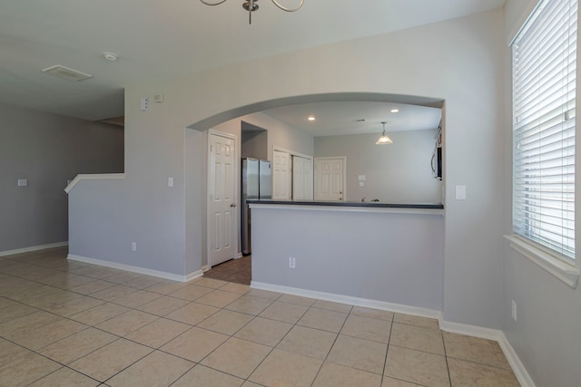 13035 Echo Landing Dr, Houston, TX 77070 - unfurnished room featuring baseboards, light tile patterned flooring, a smoke detector, recessed lighting, and arched walkways