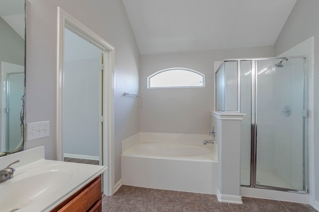 13035 Echo Landing Dr, Houston, TX 77070 - full bathroom featuring vaulted ceiling, a shower stall, a bath, and vanity