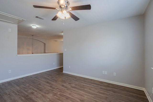 13035 Echo Landing Dr, Houston, TX 77070 - spare room featuring attic access, a ceiling fan, dark wood-style flooring, and baseboards