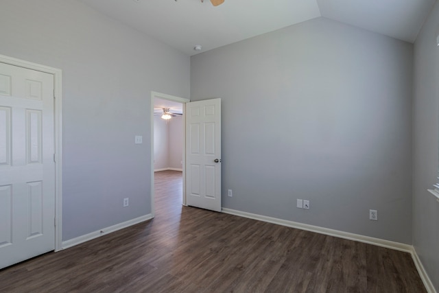 13035 Echo Landing Dr, Houston, TX 77070 - unfurnished bedroom with dark wood-type flooring, baseboards, and vaulted ceiling