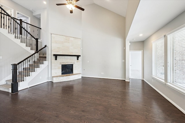 6406 Diamantina Ct, Katy, TX 77493 - unfurnished living room with a ceiling fan, stairway, wood finished floors, high vaulted ceiling, and a stone fireplace