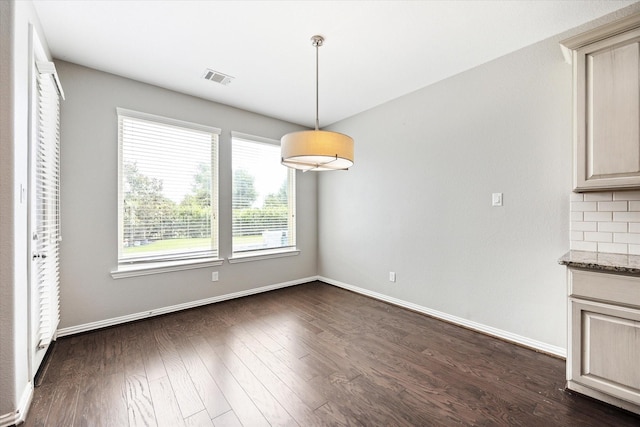 6406 Diamantina Ct, Katy, TX 77493 - unfurnished dining area with dark wood-style floors and baseboards