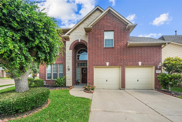 traditional home with driveway, brick siding, an attached garage, and a shingled roof