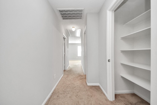 696 Rd 5105, Cleveland, TX 77327 - hallway with attic access, carpet floors, and baseboards