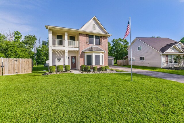 307 Squall Ct, Crosby, TX 77532 - view of front of home with a balcony and brick siding
