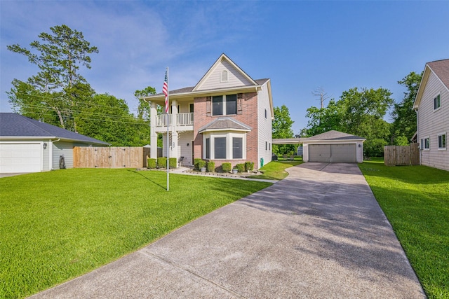 307 Squall Ct, Crosby, TX 77532 - view of front of house with an outbuilding, a balcony, brick siding, and a detached garage
